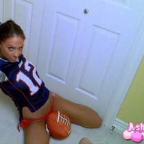 Ashley stripes out of her lil football jersey
