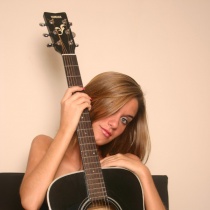 Lexi plays her guitar fully nude