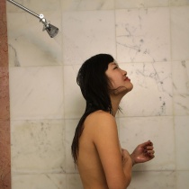 Petite Japanese babe enjoys wet shower