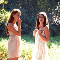 Two girls enjoy a picnic in the forest and discover their sensual side in the nude.