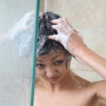 Unshaven Oriental cutie takes a wet shower
