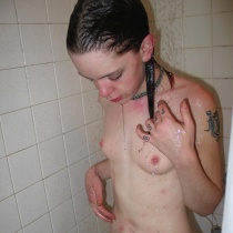 Unshaven teen takes a shower