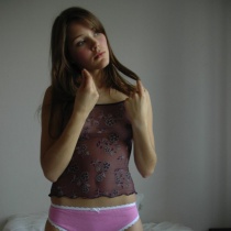 Cute teen Martina is in the bedroom waiting for you