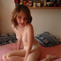 Naughty teen Amelie strips off see-thru bra and panties